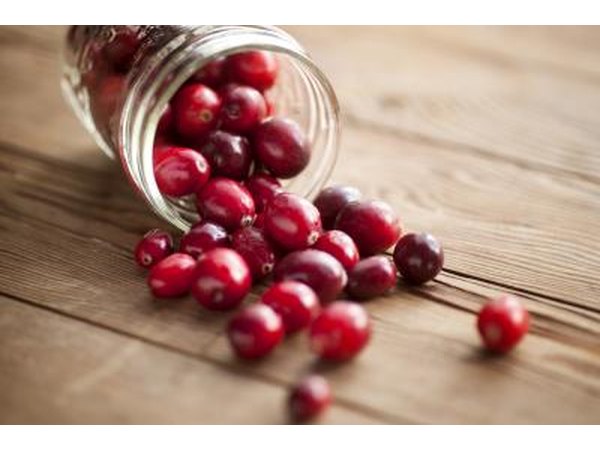 Cranberries spill onto table