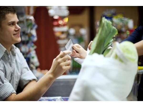 Woman paying for groceries