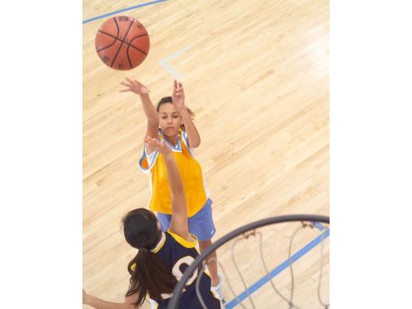 Girl blocking basketball