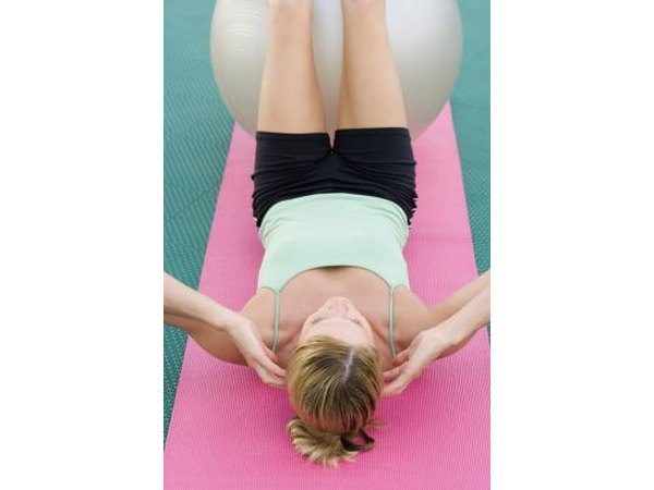Woman doing sit ups with exercise ball