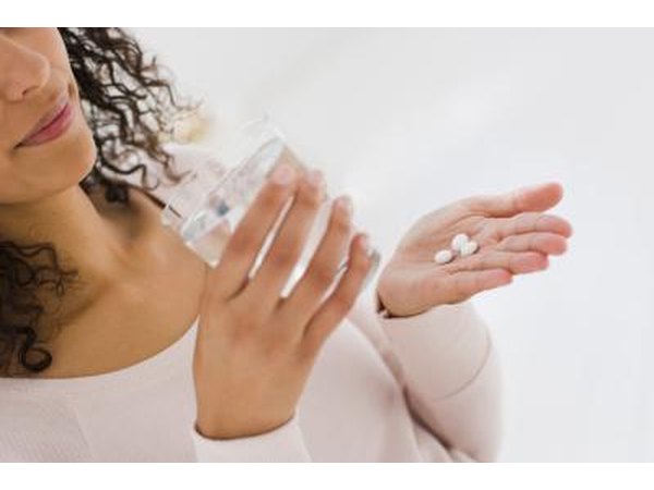 woman taking medicine