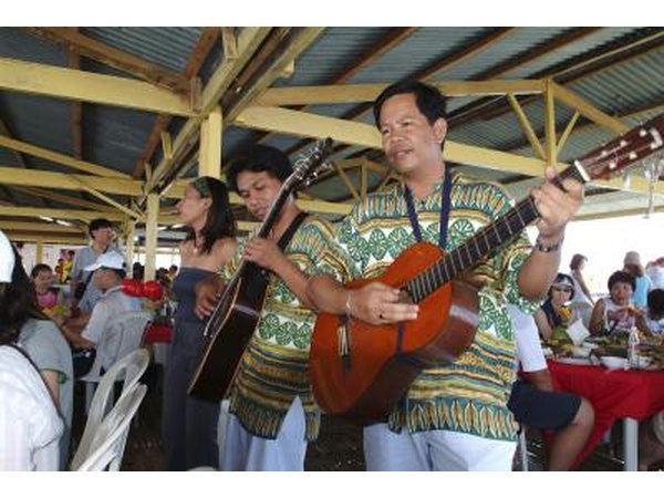 Entertainers perform at a Tiki-themed restaurant.