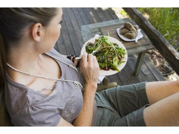 woman eating salad