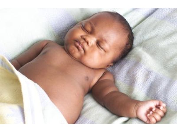 A newborn baby sleeps.