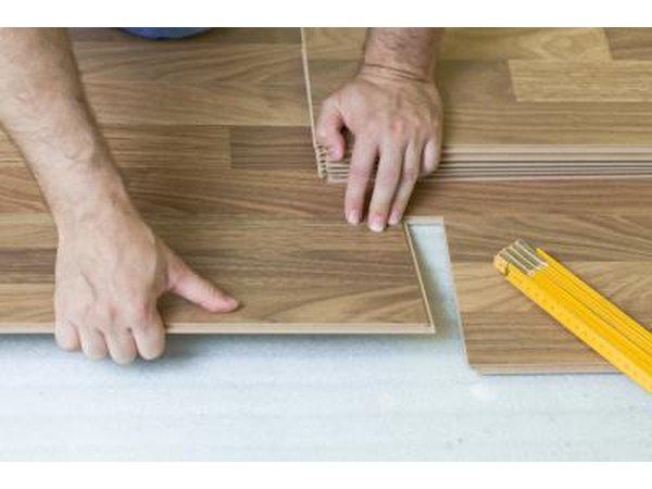 Installing the final pieces of a laminate floor