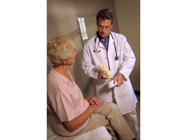 Elderly woman talking to doctor