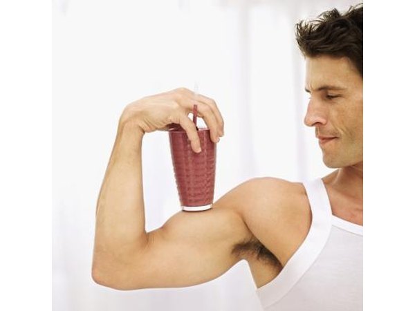 Strong man with smoothie