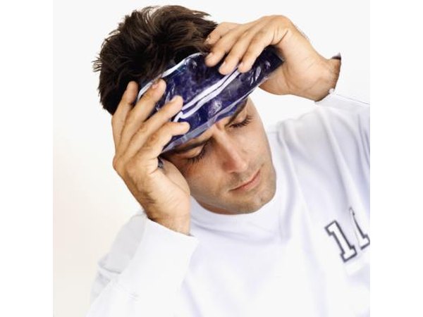 Man with icepack on forehead