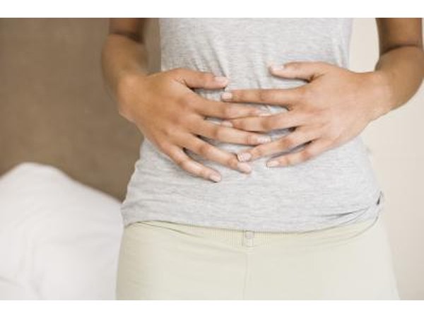 Woman holding abdomen
