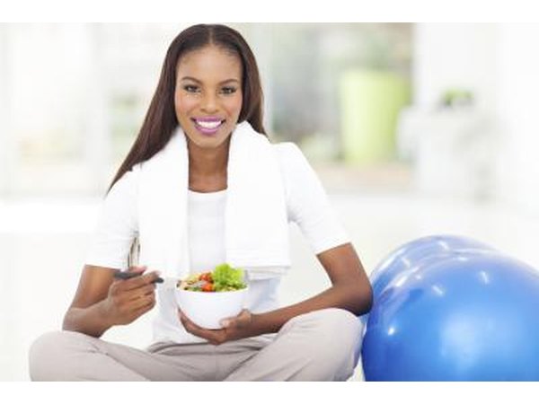 Young woman eating a healthy meal after a workout