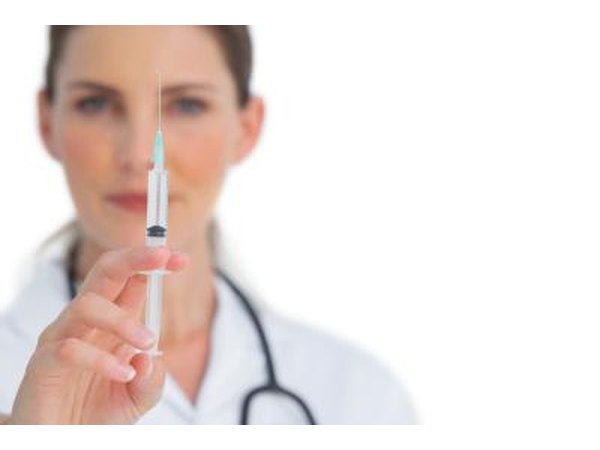 Nurse with syringe for injection.