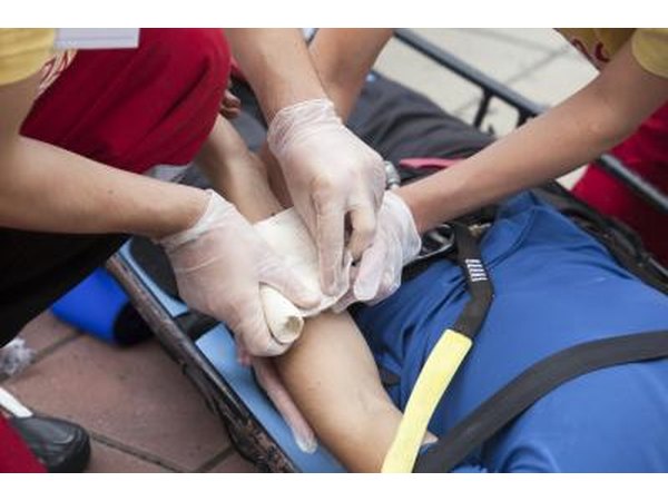 Man receiving first aid for injury