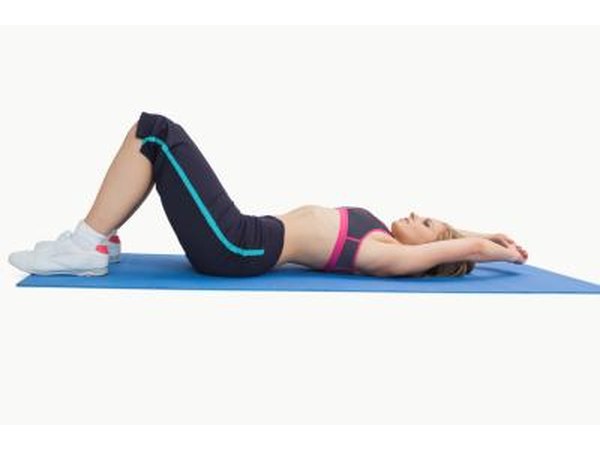 Woman on floor stretching legs.
