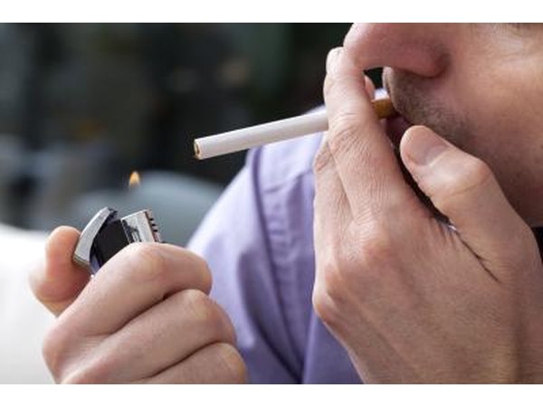 A man about to light a cigarette