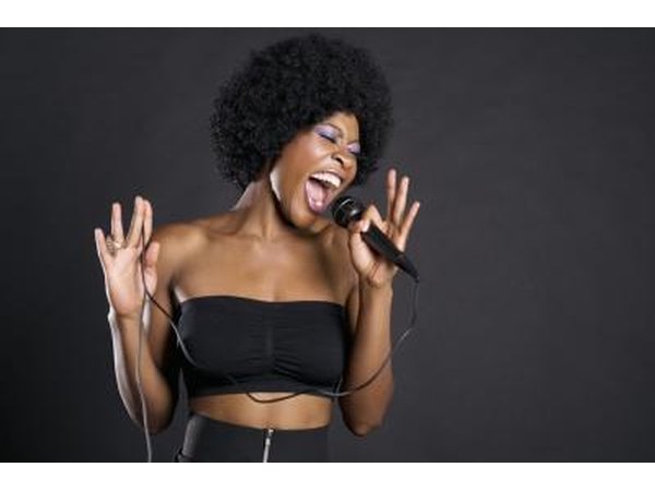 Woman singing into microphone