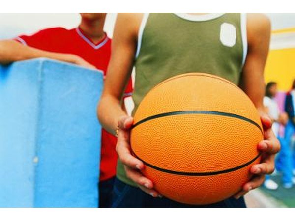 Teen boy holding basketball