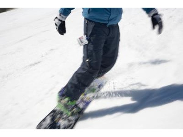 Snowboard pants are typically looser and roomier than ski pants and often combine two or three layers of the three-layer system.