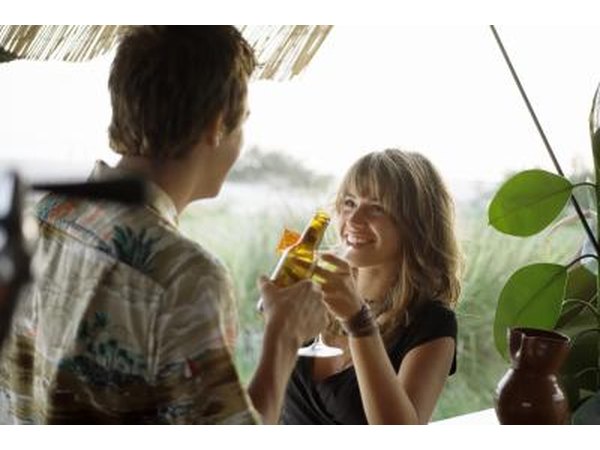 Couple toasting at outdoor bar