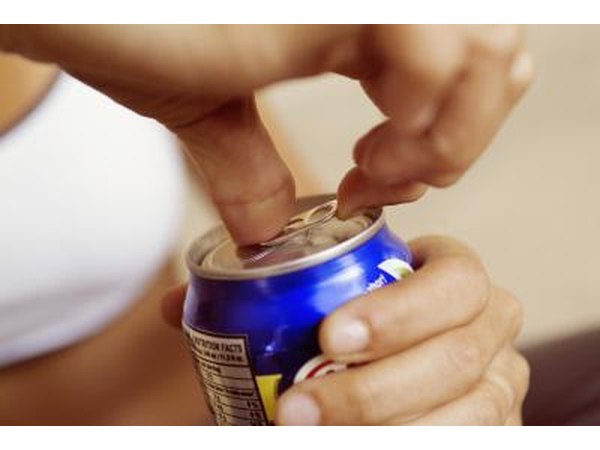 woman opening soda can