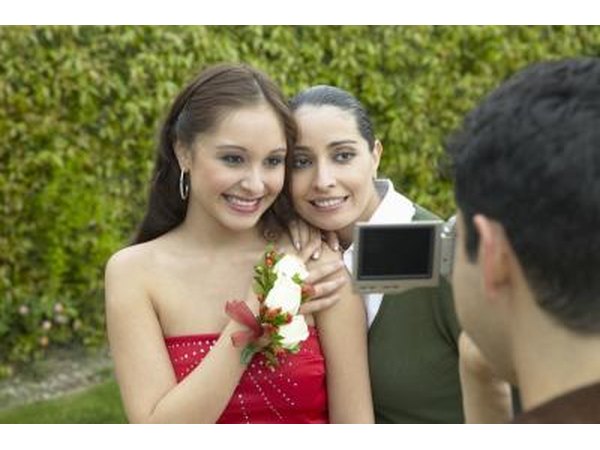 Mother hugging daughter before prom
