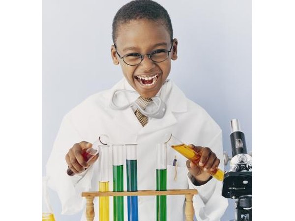 Boy playing with science kit
