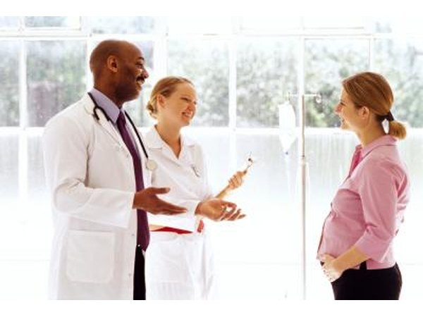 Woman talking with doctors