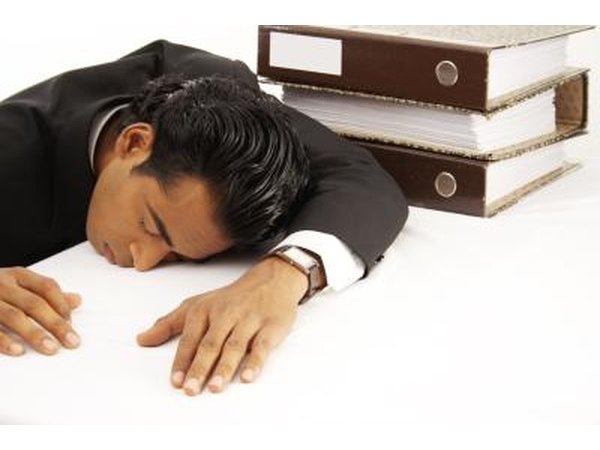 Young business man taking a nap.
