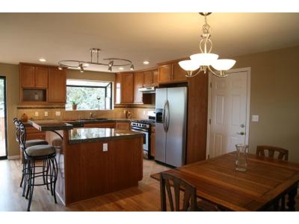 Biscuit-colored walls can update pickled oak cabinetry