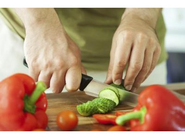 man slicing vegetables