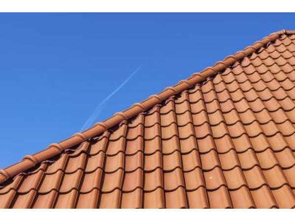 If you have a terracotta tile roof green is a good choice for a trim color.
