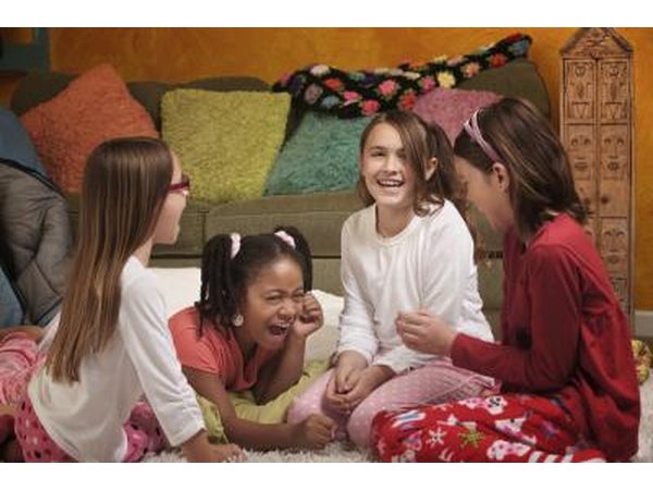 Girls at a slumber party playing a game