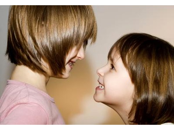 Sisters smile at each other