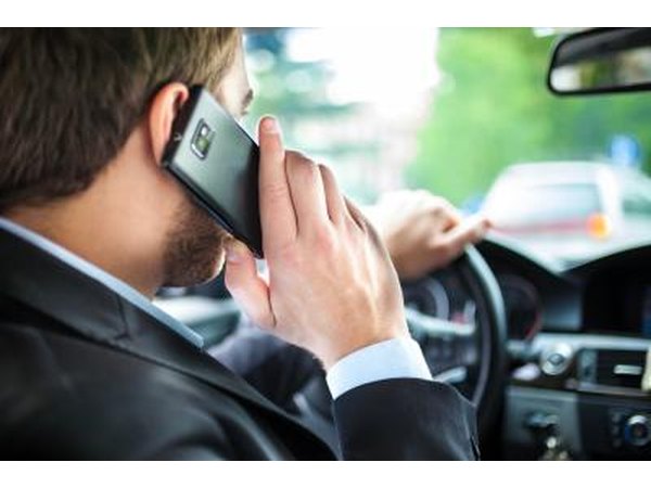 Man driving on phone