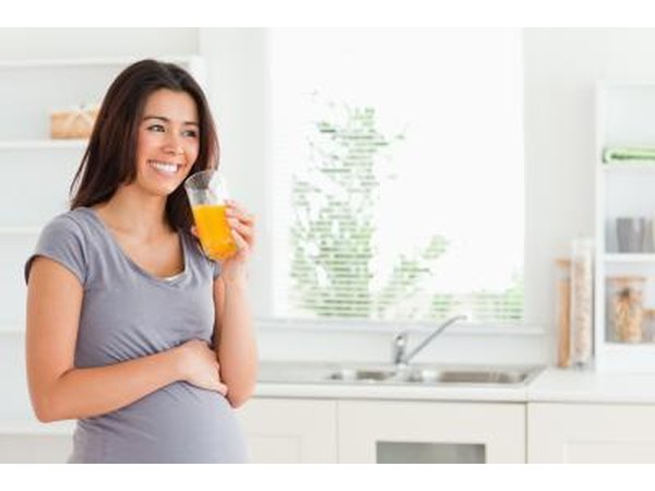 pregnant woman drinking pineapple juice