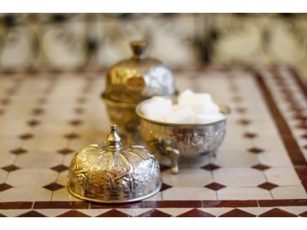 Gold, silver and crystal bowls provide readily available containers for winter wonderland centerpieces