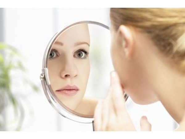 Woman looking at skin