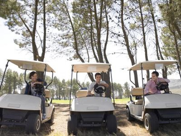 Three men about to race carts