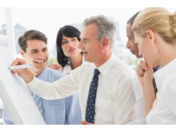 Co-workers playing a draw and guess game at the office.