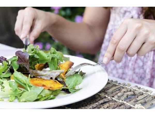 Woman eating salad