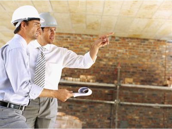 Two architects discussing the ceiling.