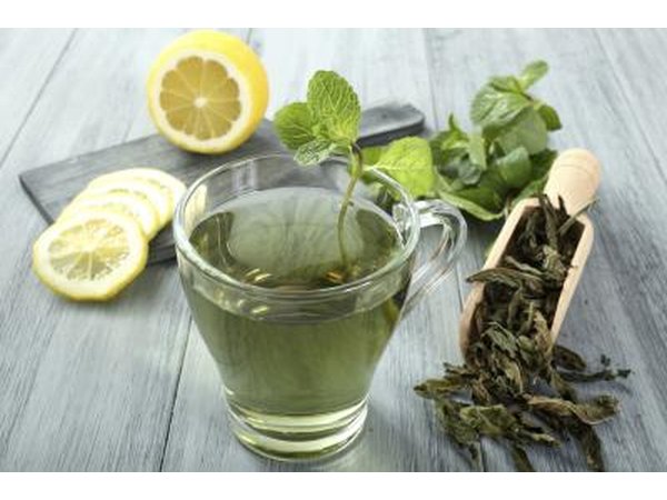 A cup of green tea with lemon.