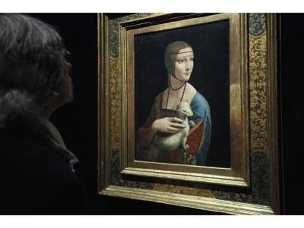 A museum patron looks at the painting "Lady With An Ermine", by Renaissance painter Leonardo da Vinci
