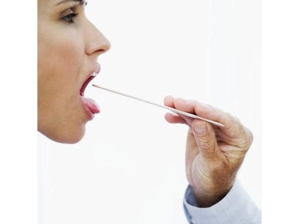 Examining throat.