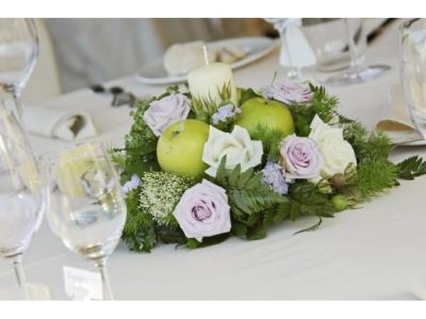 Mix fruits and flowers together for an exquisite dining table centerpiece.