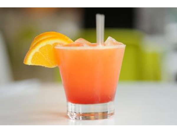 A refreshing Black-Eyed Susan cocktail garnished with an orange slice.