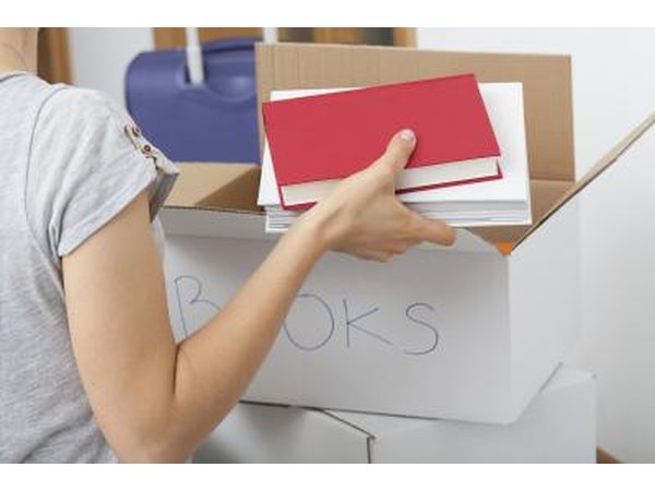 Woman packing boxes of books