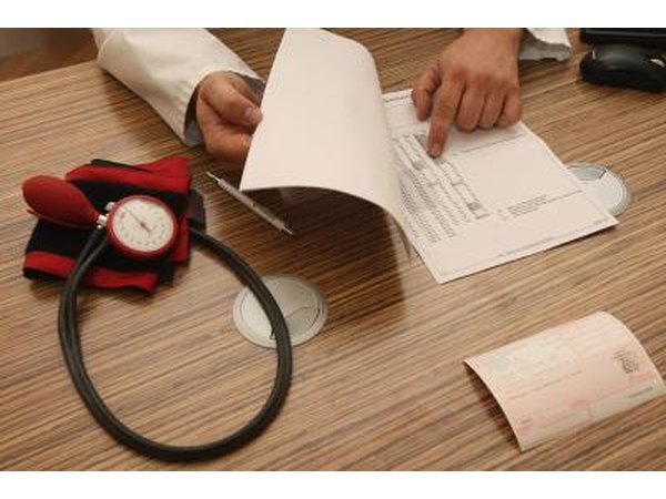 Doctor showing patient high blood pressure / hypertension results