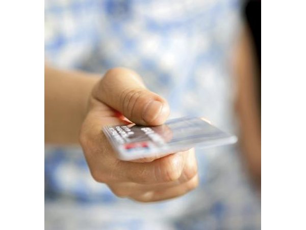 Hand holding a credit card