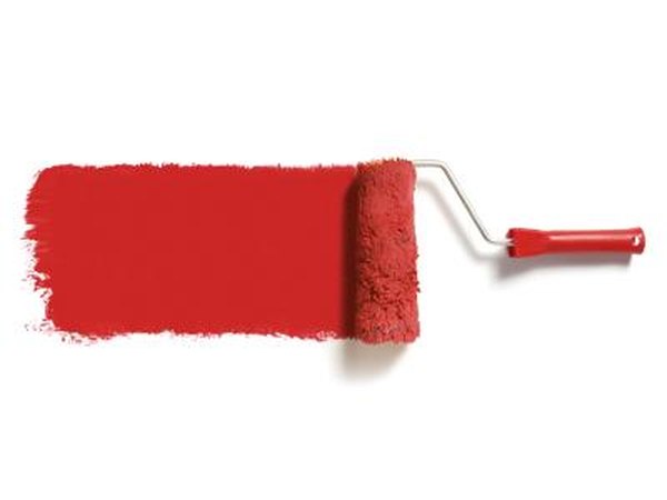 Roller with red paint.