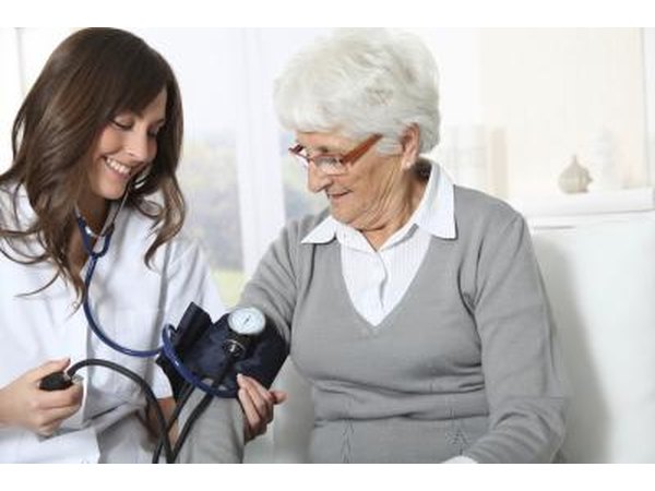 Senior woman gets blood pressure test